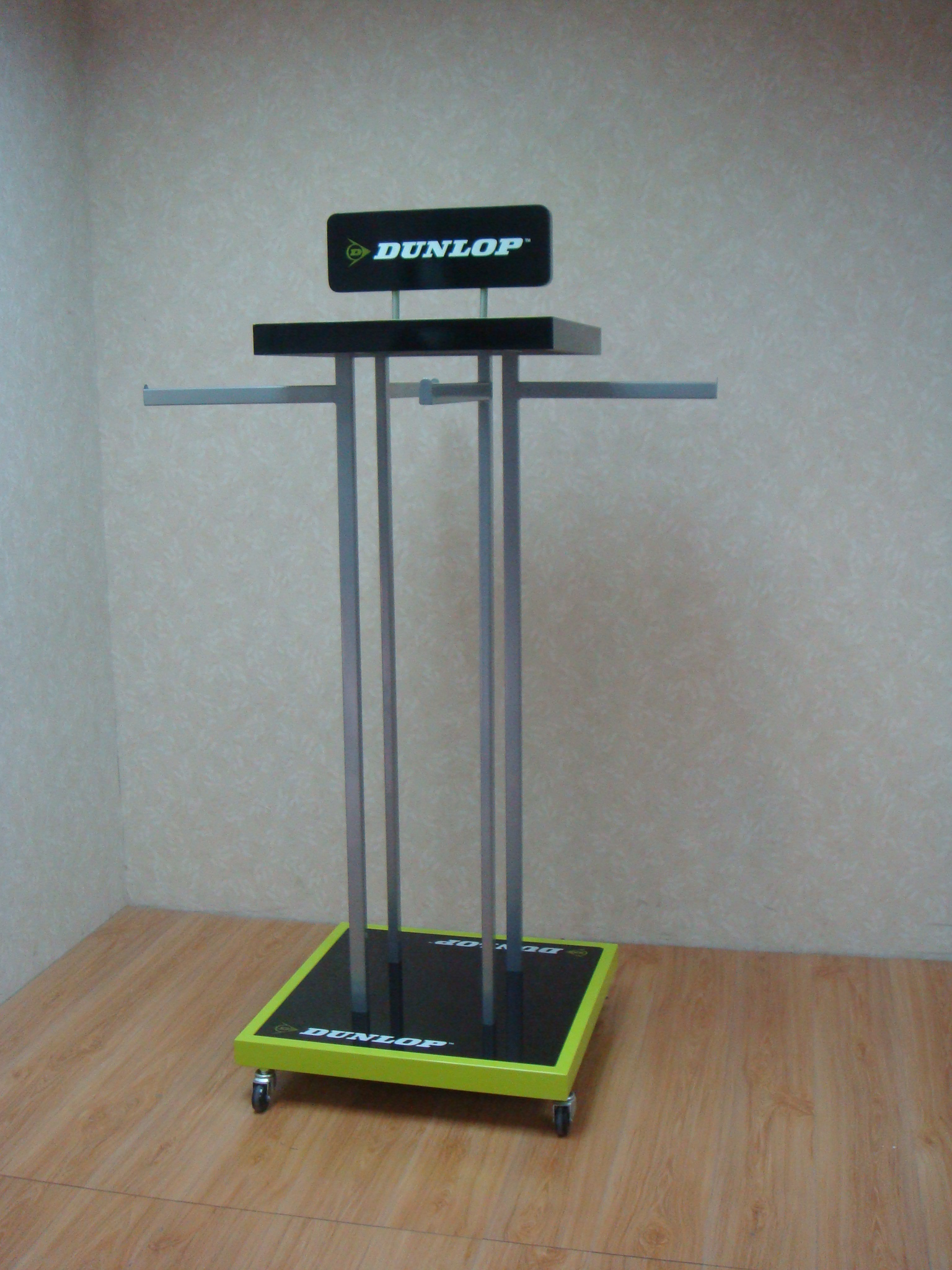 DUNLOP sports apparel retail display fixture installed in a standalone brand store