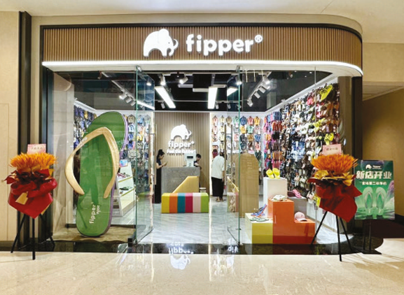 Slipper shop retail environment in Malaysia showing rubber slipper merchandising