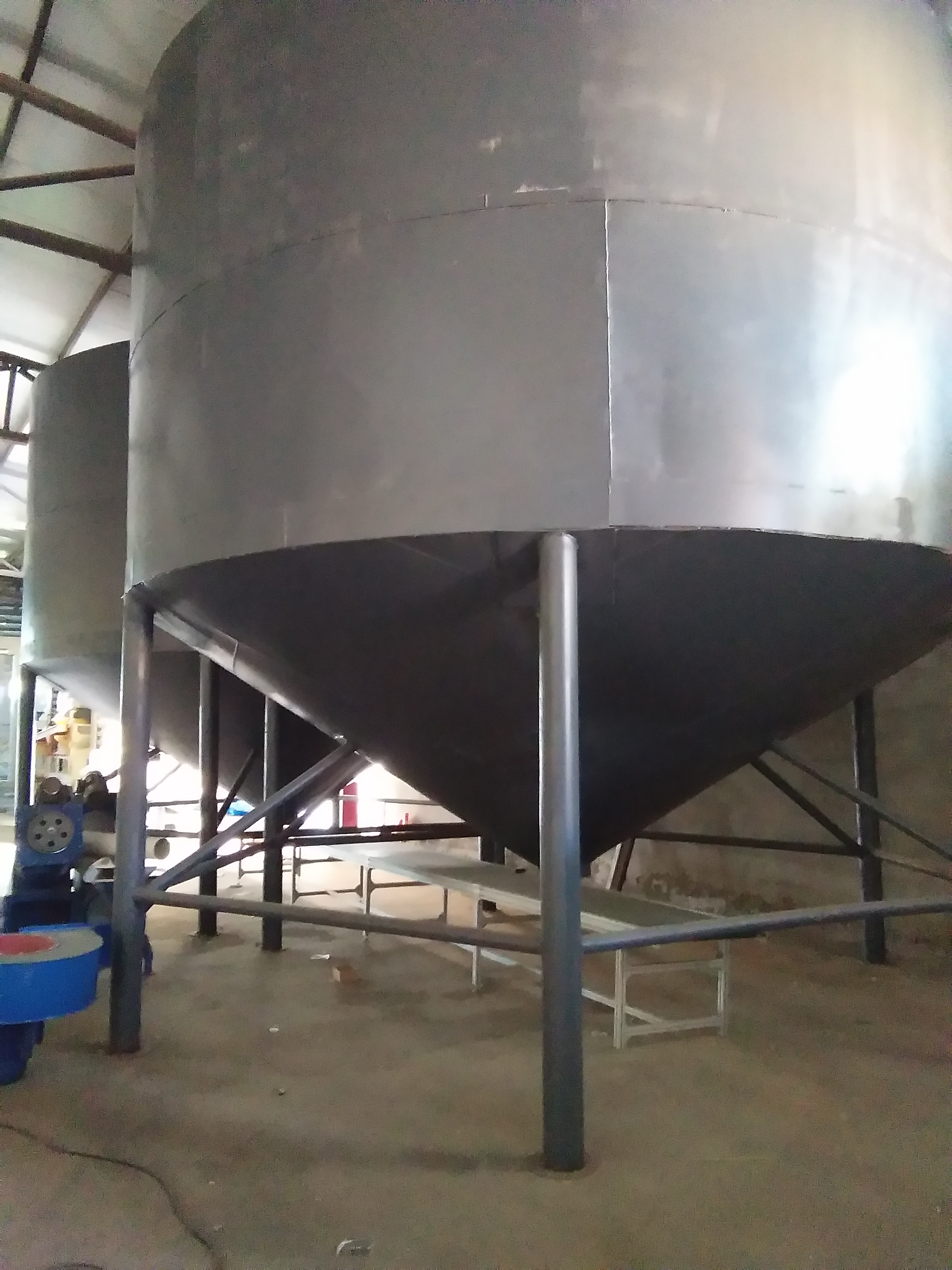 Bulk pumpkin seed storage silos in an Inner Mongolia processing facility