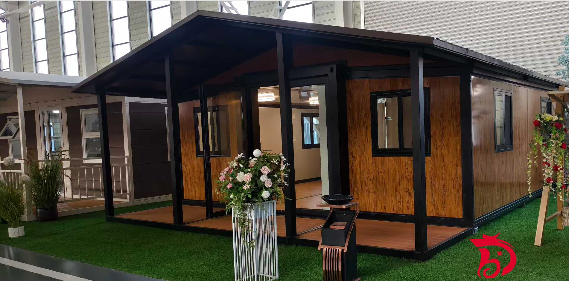 Double-wing expandable container house with terrace deployed for resort and campsite accommodation