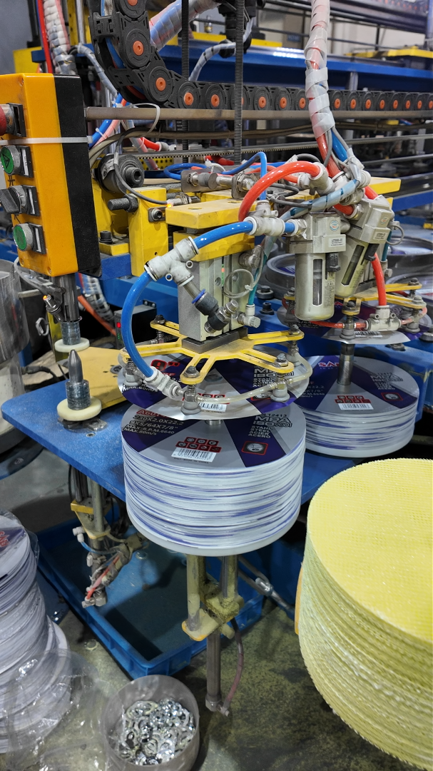 Resin-bonded Type 41 cutting disc production line producing diameter runs before batch testing