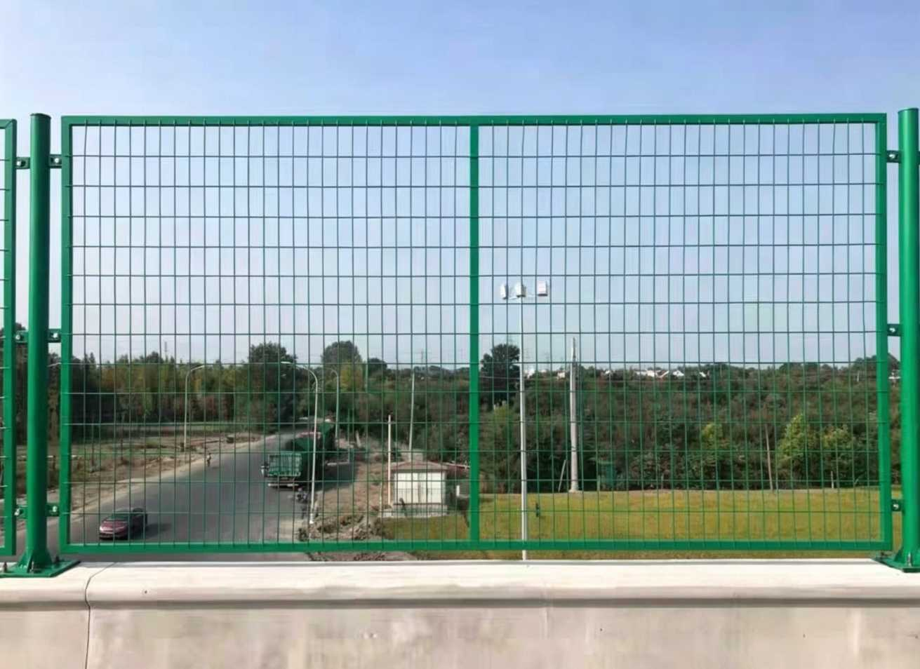 Welded steel anti-throw mesh with a welded post-and-mesh assembly for falling-object protection on bridge and elevated road edges