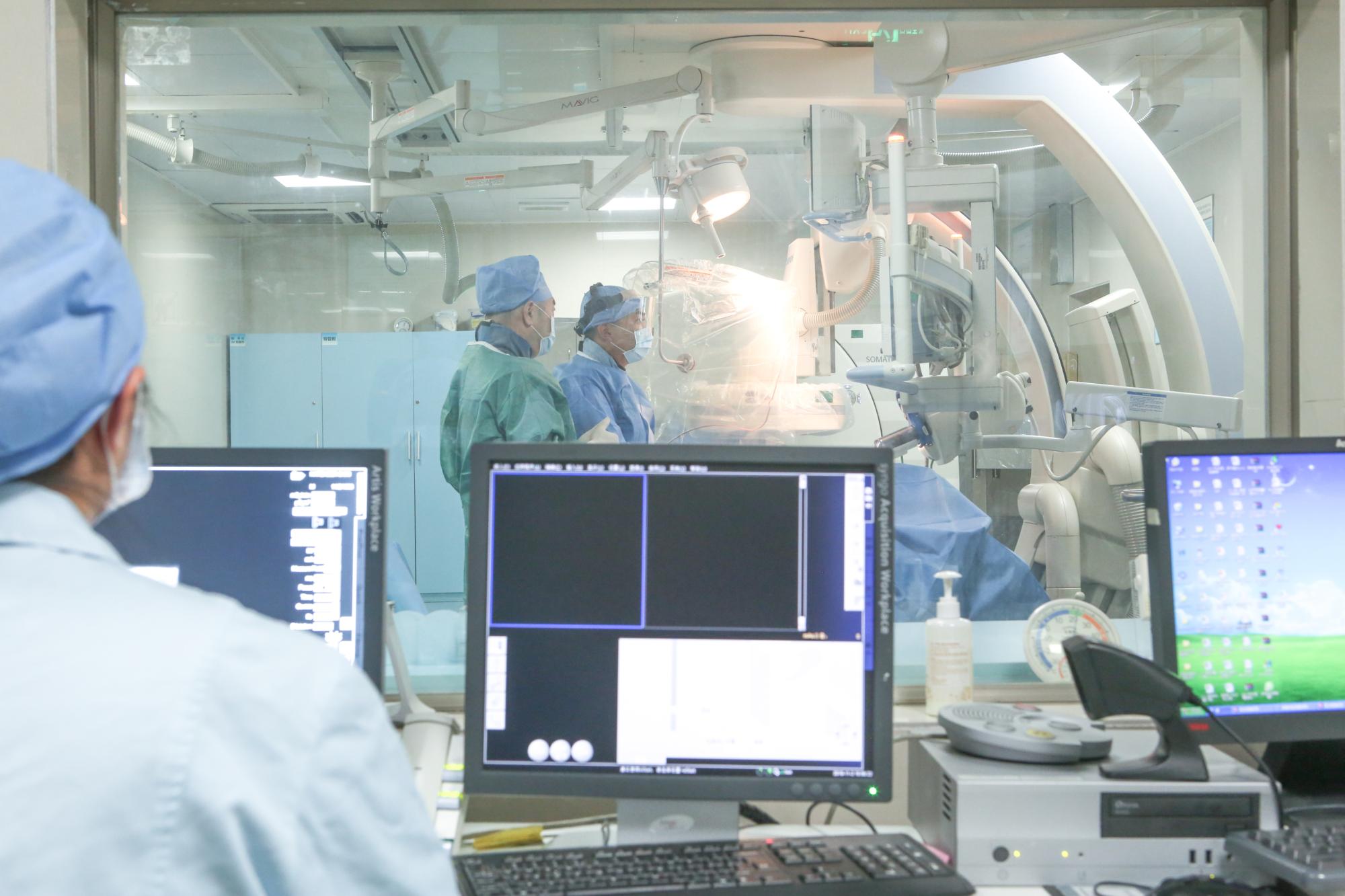 Interventional treatment room used for image-guided oncology procedures at a minimally invasive cancer treatment hospital