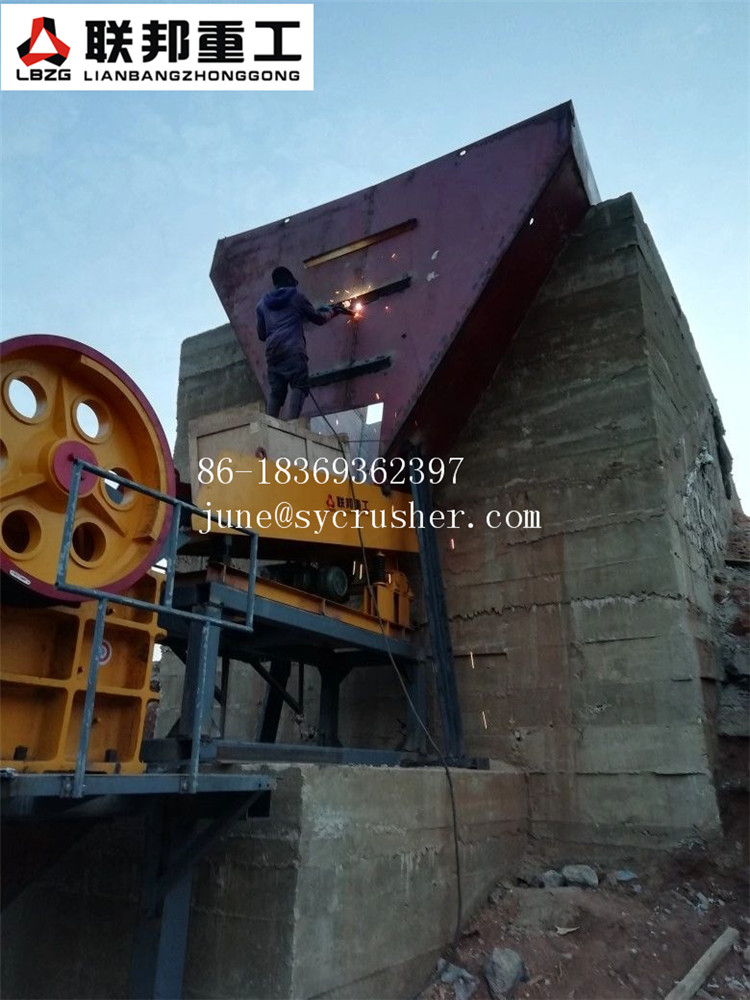 Jaw crusher operating at a stone crushing production line site