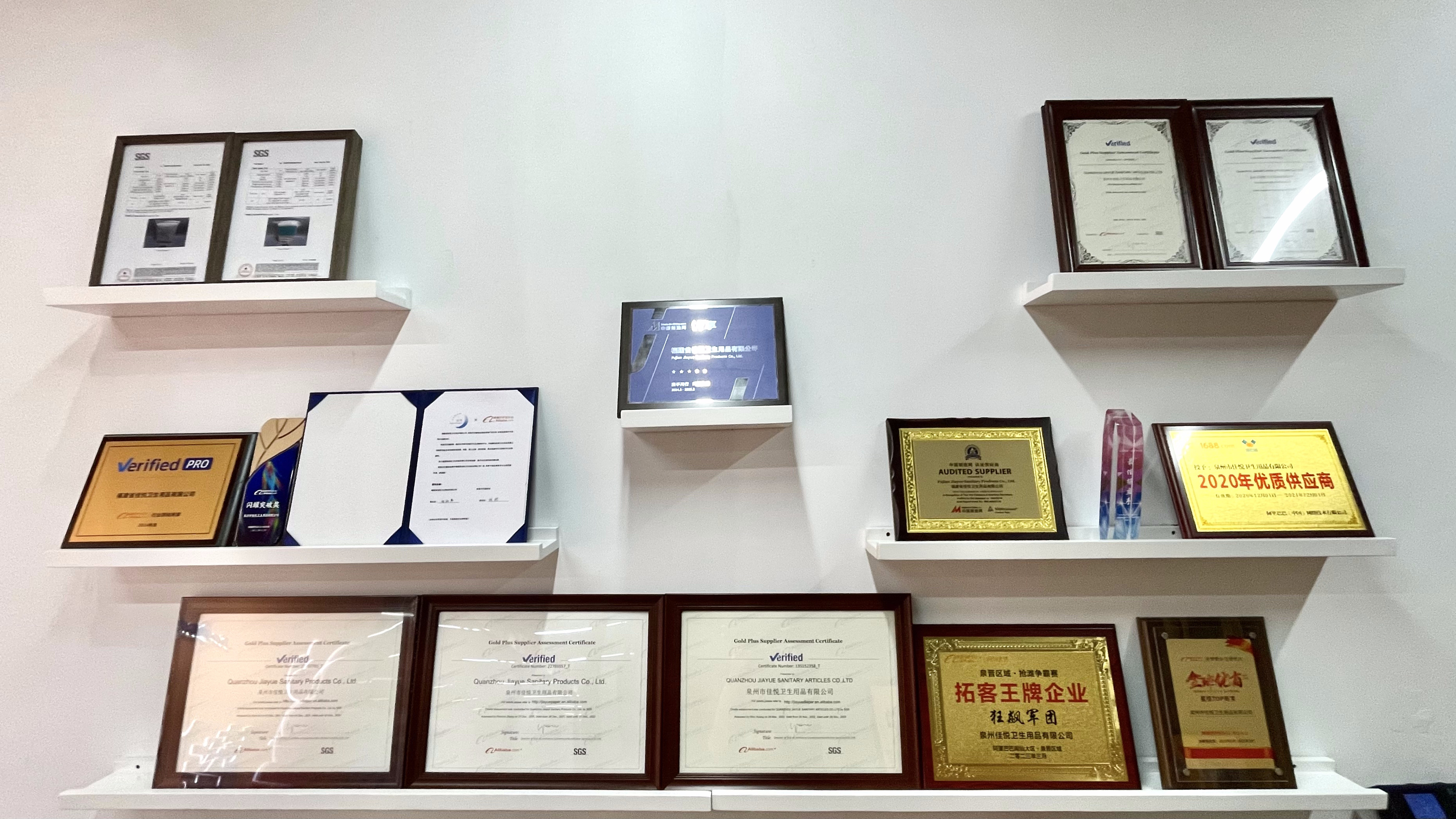 Certificate wall at the Jiayue manufacturing facility showing quality management and product conformity documents