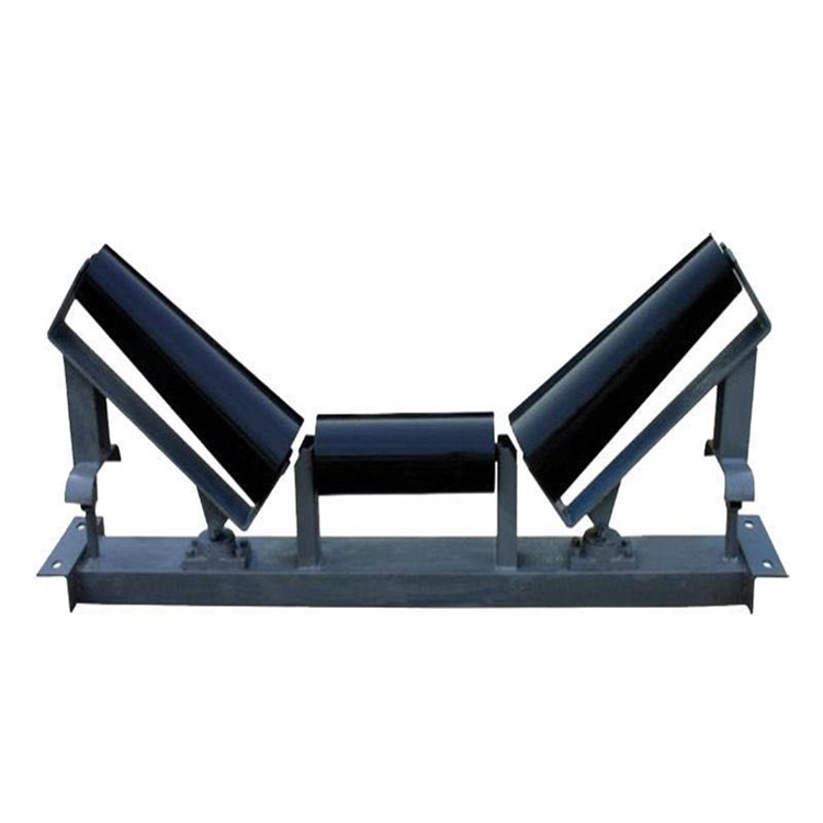 Self-aligning conveyor idler for belt mistracking correction