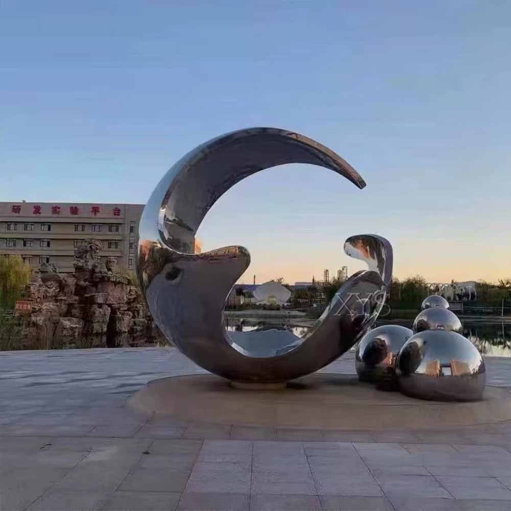 Large-scale stainless steel landscape sculpture with mirror finish