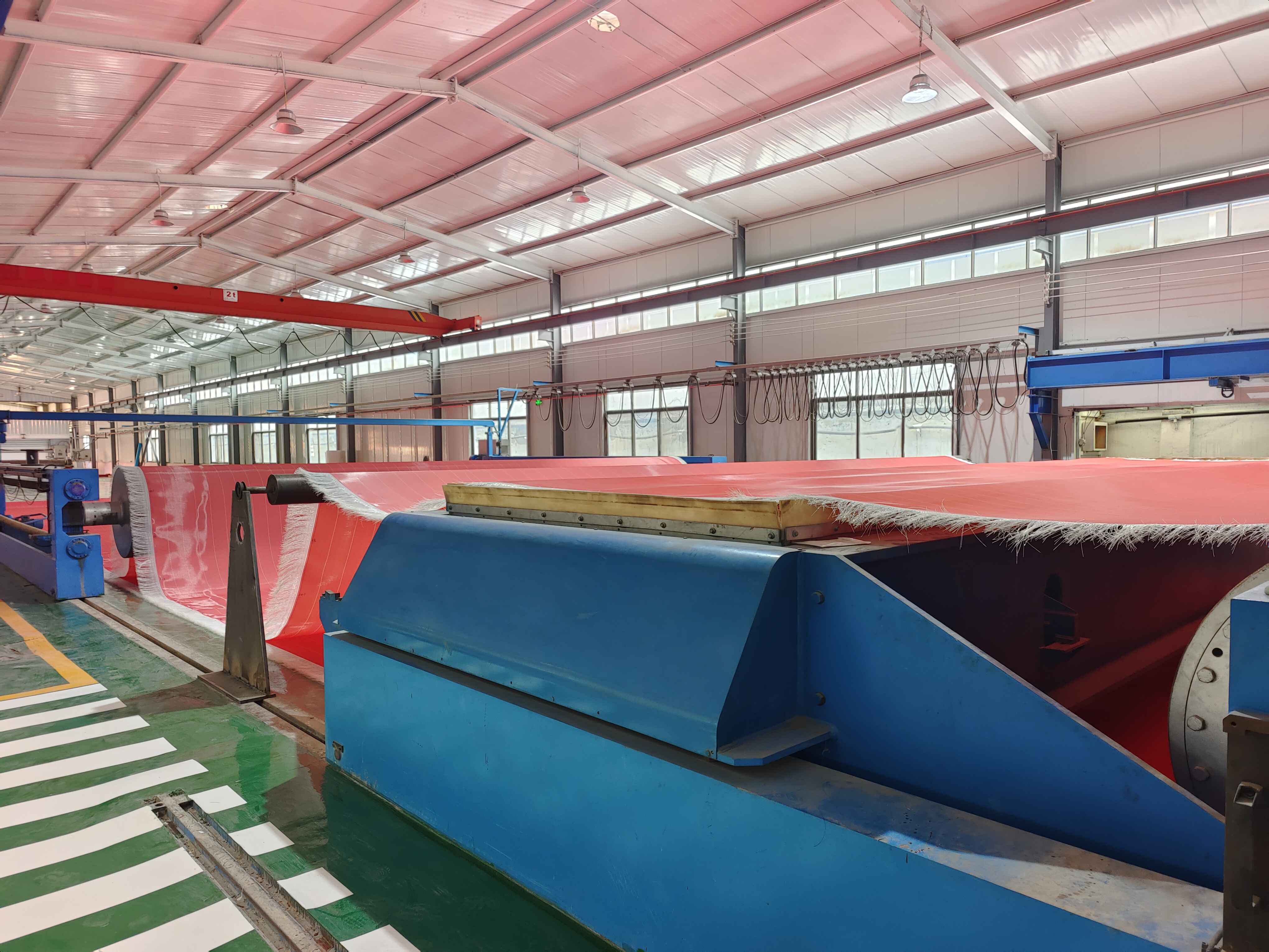Polyester nonwoven mesh belt production in a specialist manufacturing plant