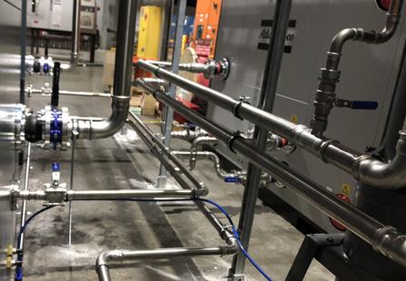 Residential house press-fit plumbing scene with stainless steel press fittings