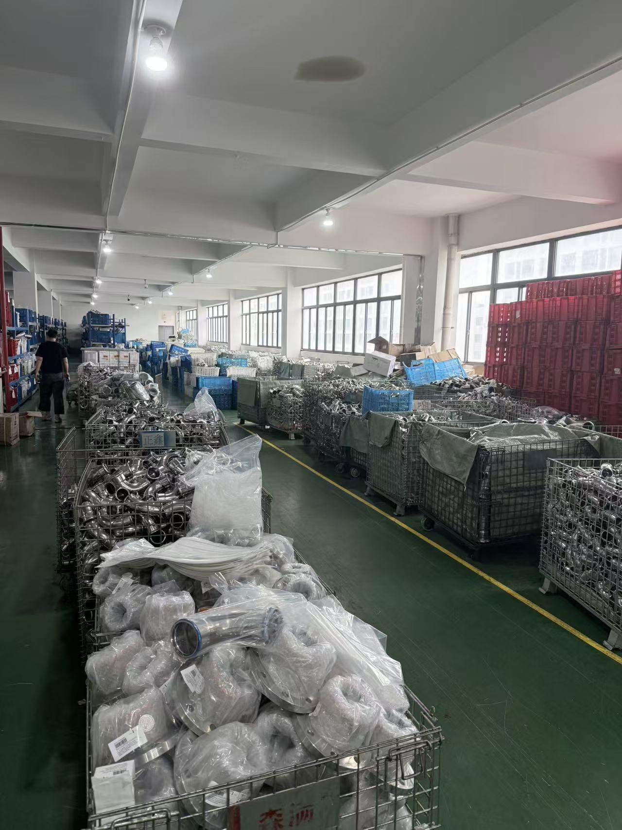 Warehouse stock of stainless steel press-fit fittings ready for shipment