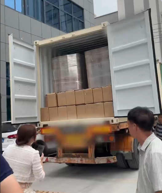 Cartons and palletised POF shrink film consignments loaded inside an export shipping container