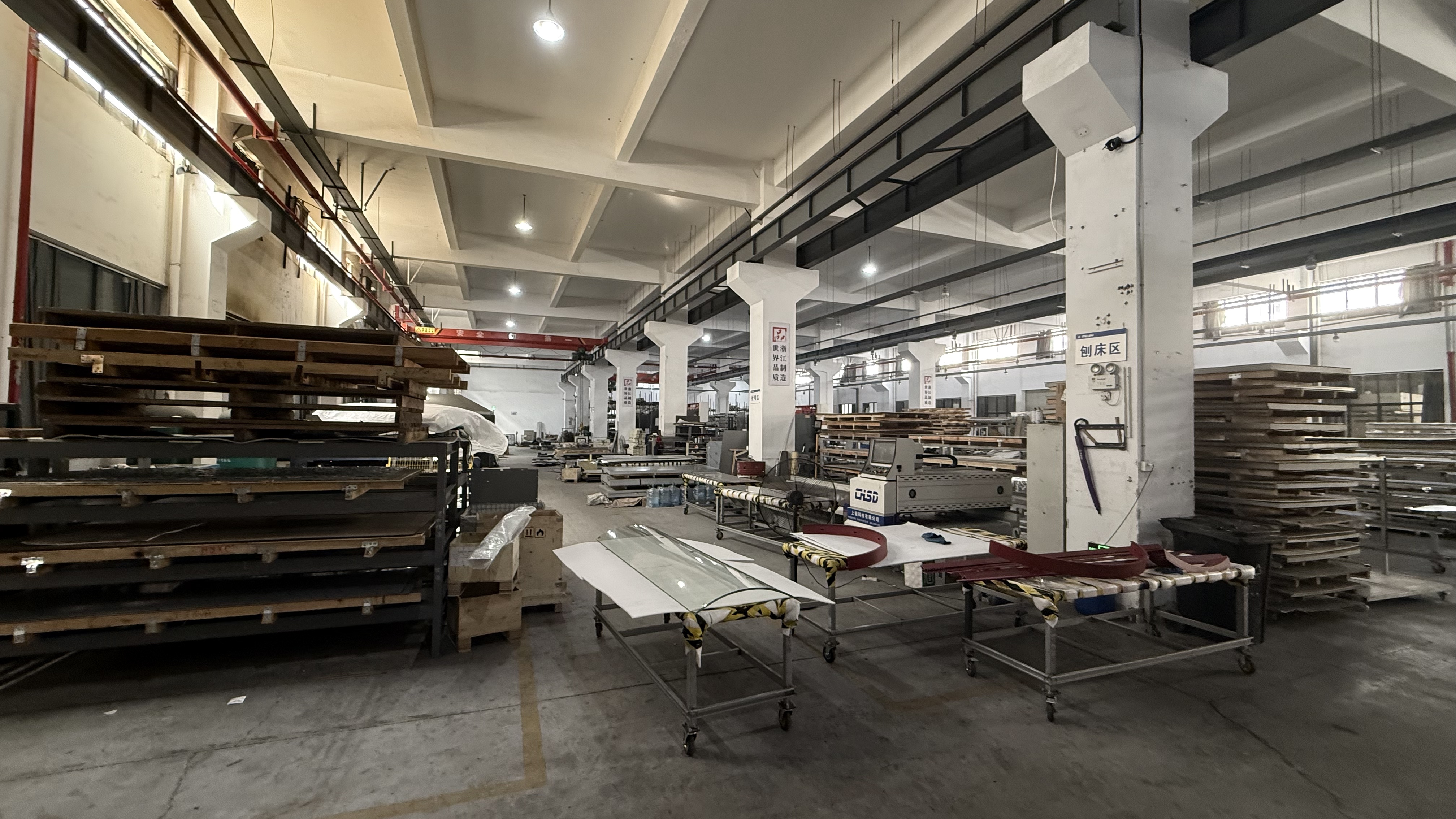 Press brake workshop forming sheet-metal components at a residential elevator manufacturing facility