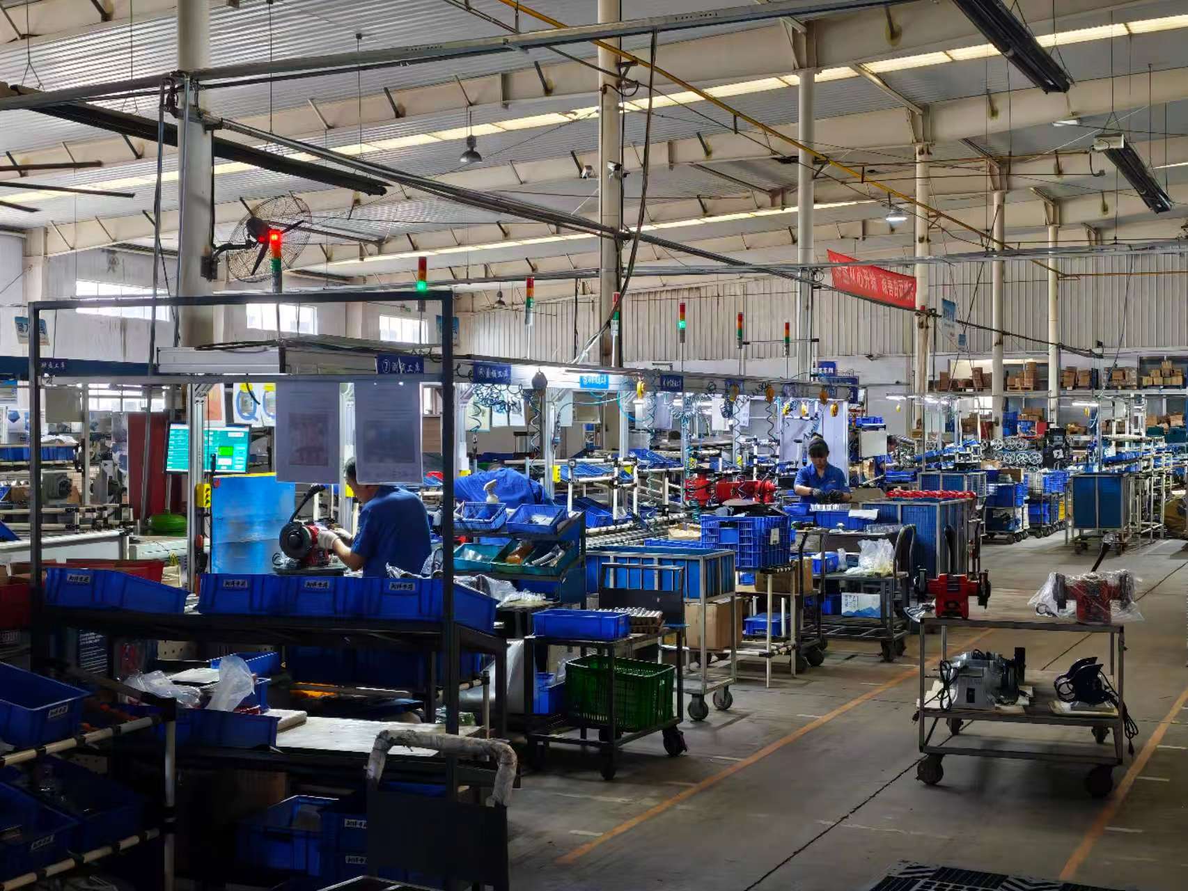Bench grinder assembly line representing 2026 motor and drive supply chain capacity