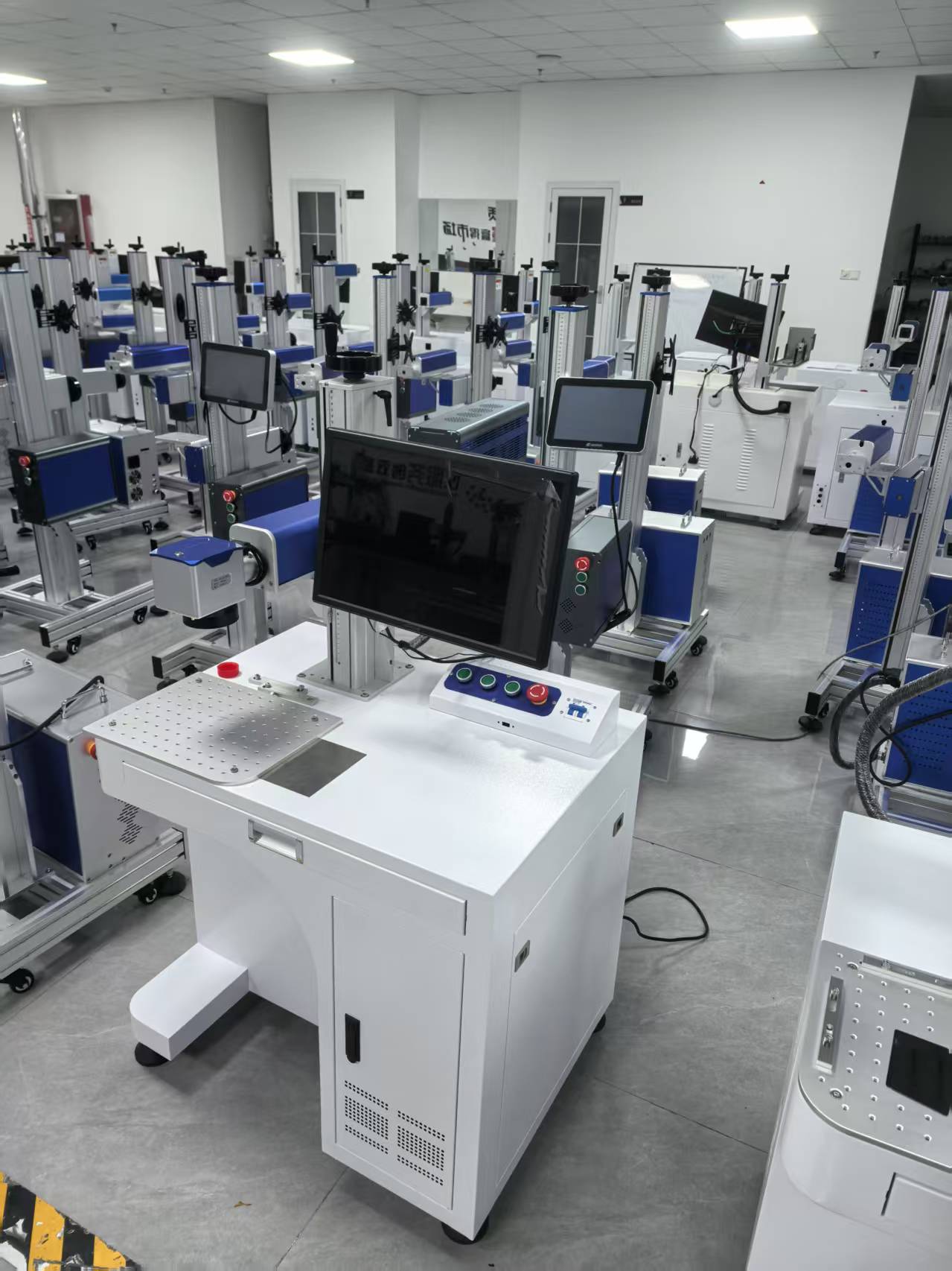 Pre-shipment inspection and aging test area for portable handheld laser marking machines