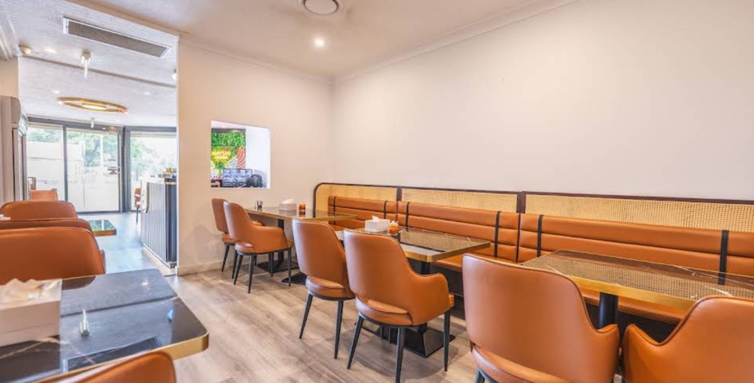 Restaurant set combining upholstered chairs, booth seating and dining tables