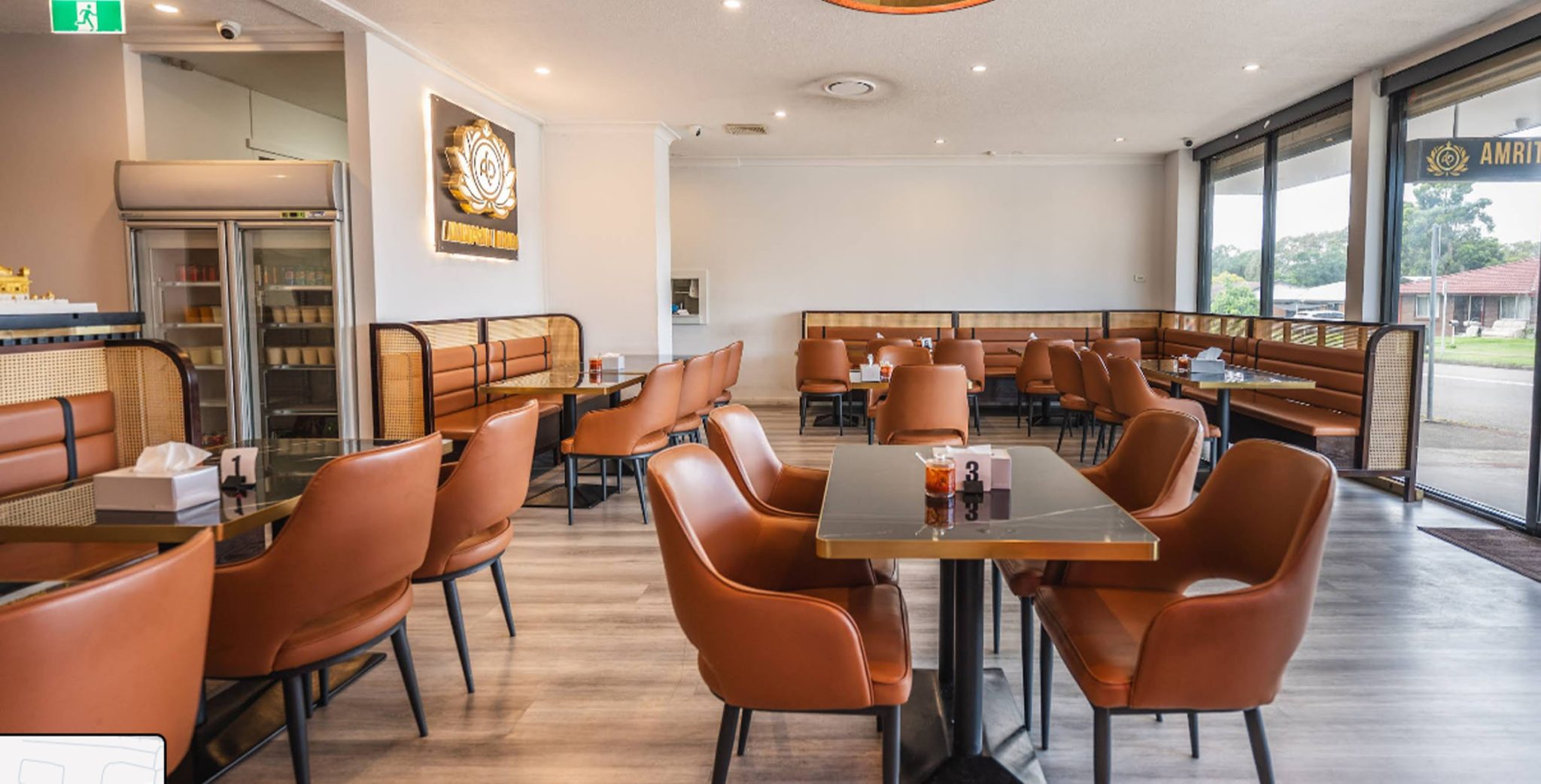 Complete restaurant furniture set with dining chairs and tables installed across a spacious modern restaurant dining area