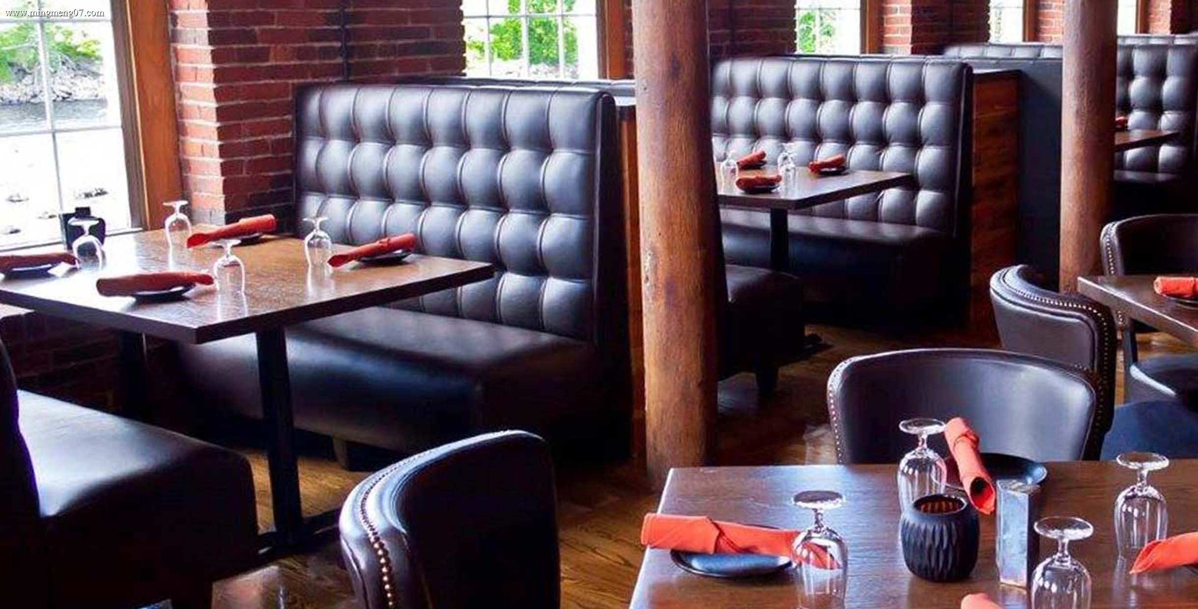 Custom restaurant booth seating designed for a fixed wall-side dining zone