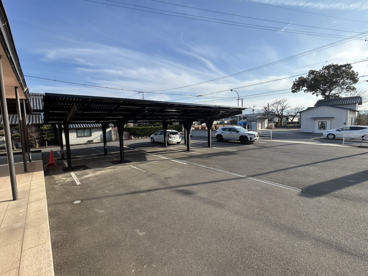 Waterproof carport solar structure with drainage detail
