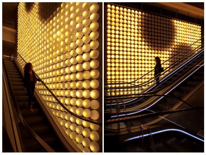 Opal white glass globe lamp shades installed as ambient lighting in a luxury retail interior