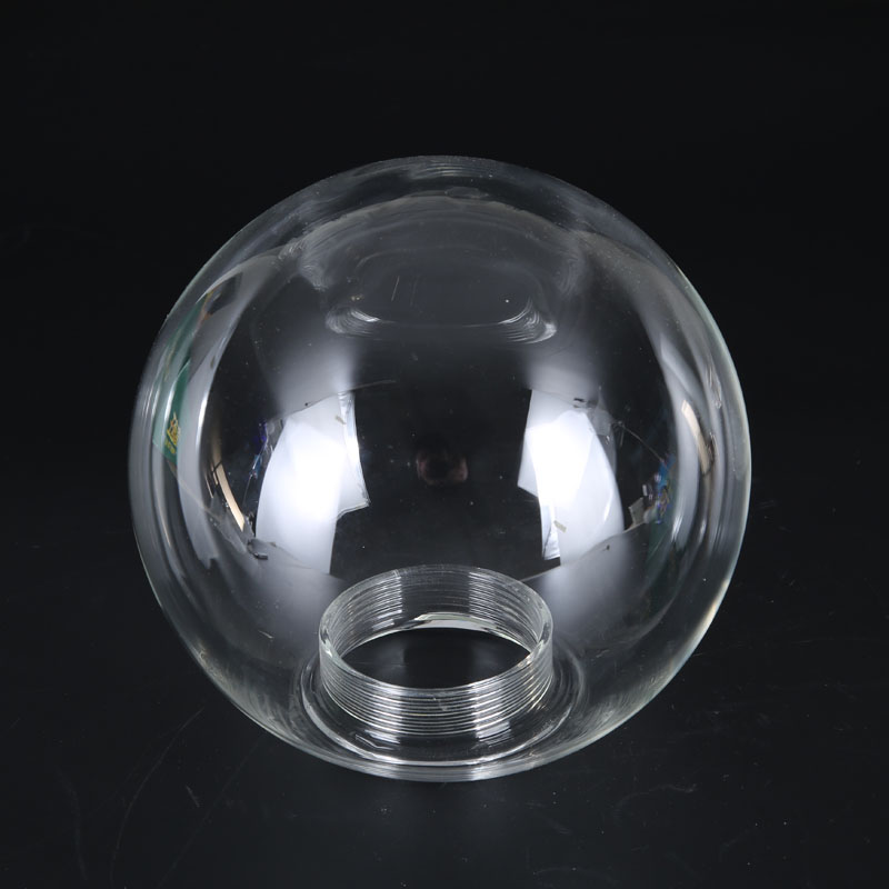 Clear hand-blown spherical glass lamp shade with threaded bottom fitter, 150 mm diameter