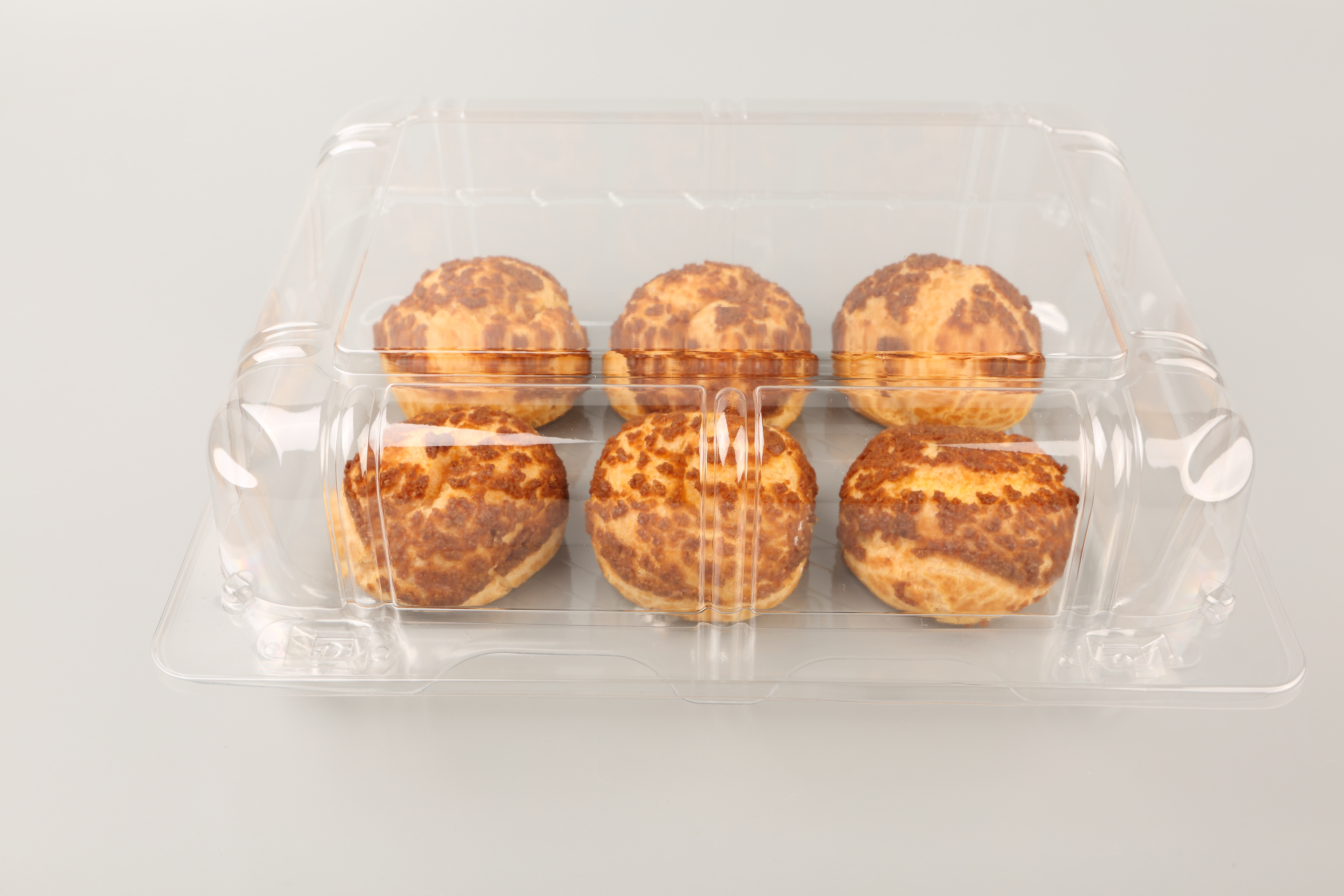 Plastic hinged food packaging container used for supermarket bakery products