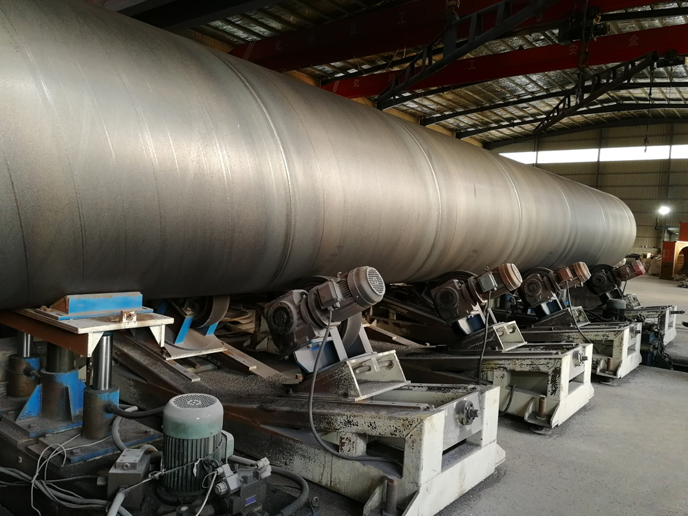 Large diameter spiral welded steel pipe stacked for an industrial pipeline project