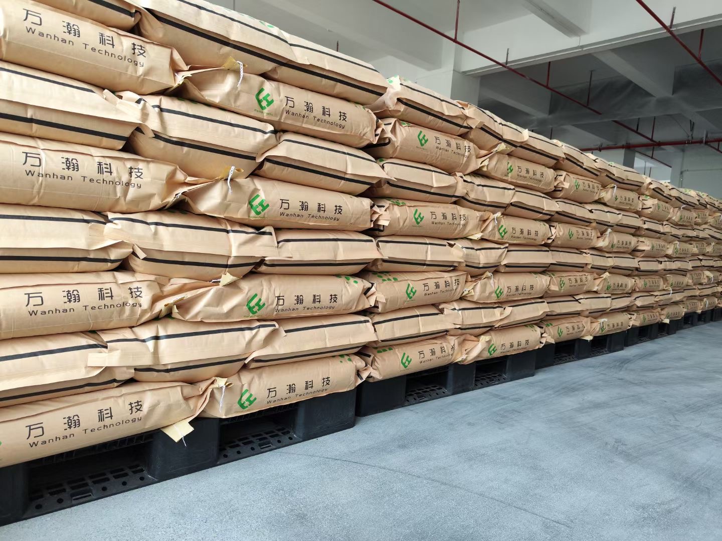WanHan packaged modified engineering-plastic pellets being prepared for loading and shipment.