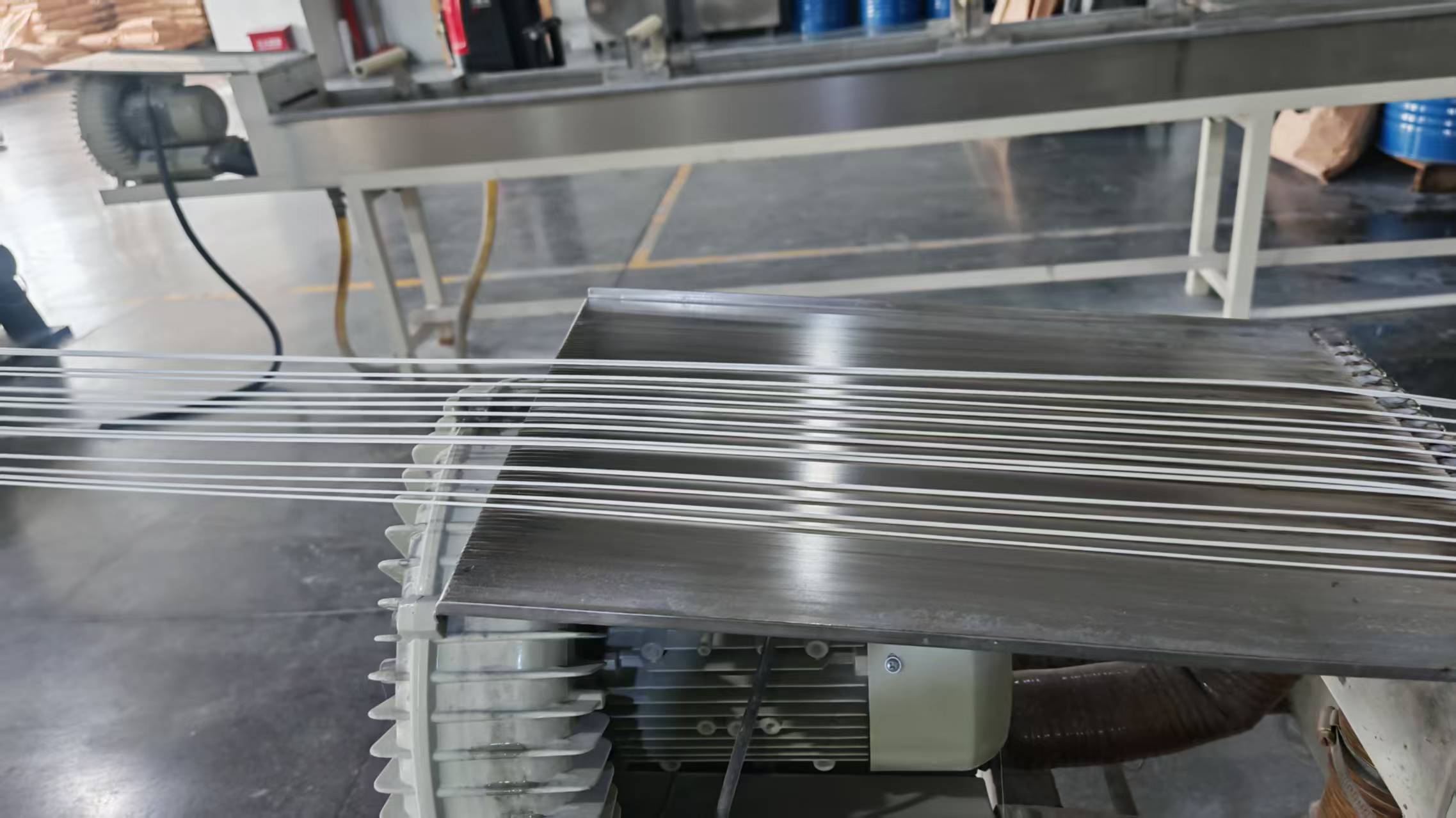 Extrusion stage in modified engineering plastic compounding production where reinforcement and flame retardant additives are dispersed in the polymer melt