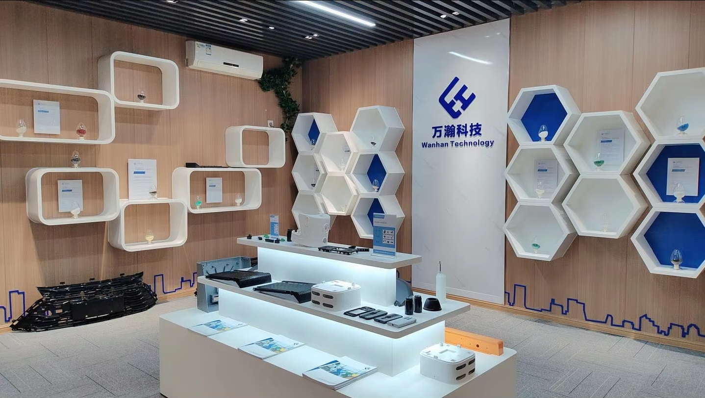 WanHan Plastic material and sample display area at the company site. The exhibits show examples of pellets and molded parts; individual grade and performance claims require separate product documentation.