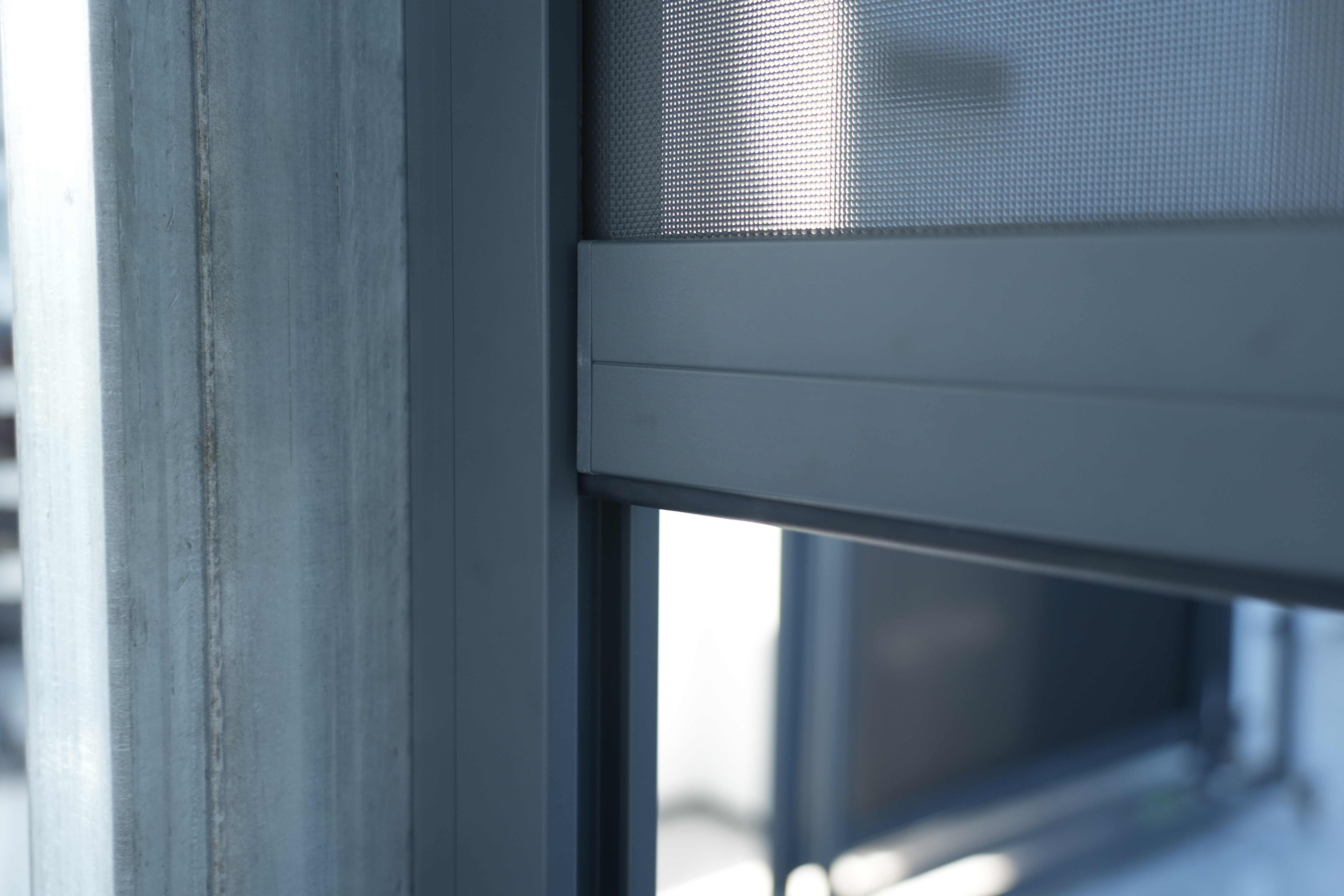 Outdoor windproof roller blind installed on a residential terrace