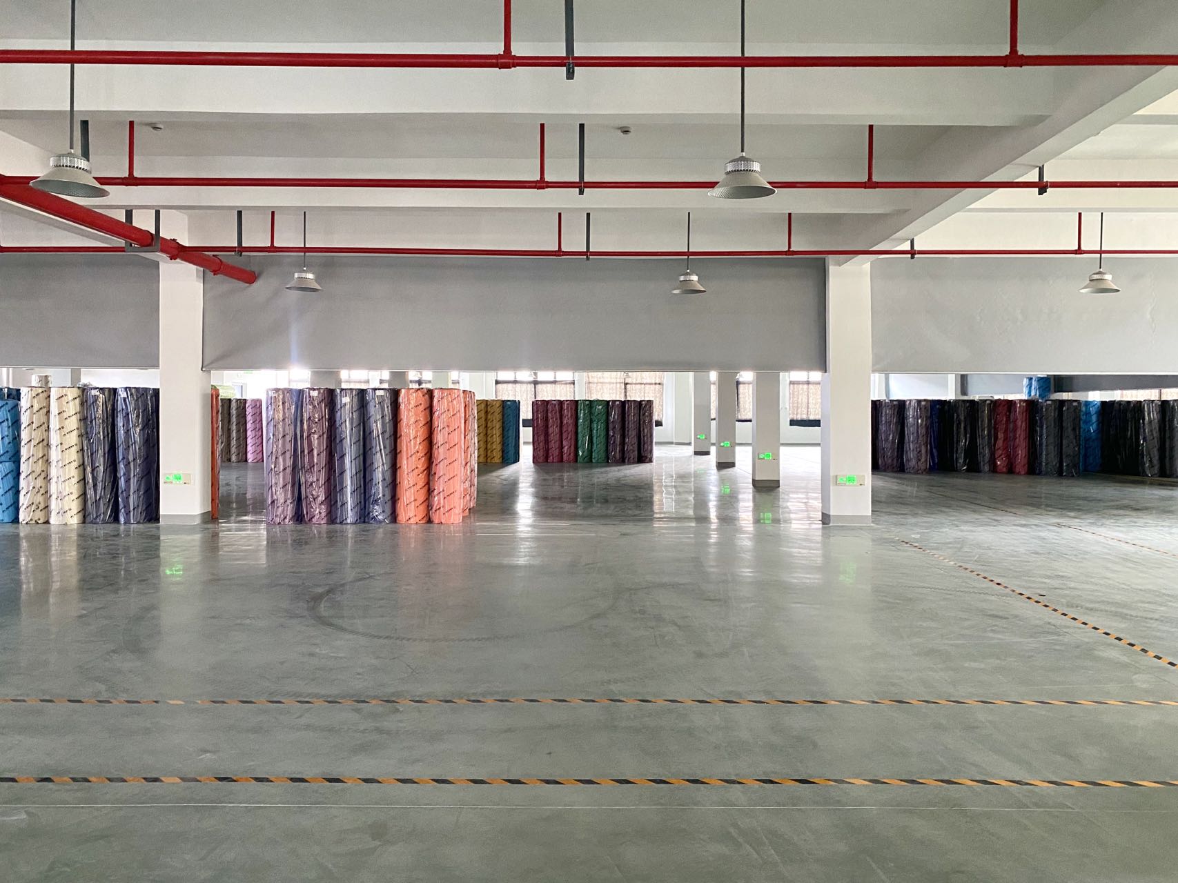 Runjiang Fabric Warehouse - fabric rolls stored in the warehouse of Zhejiang Runjiang New Material Technology Co., Ltd.