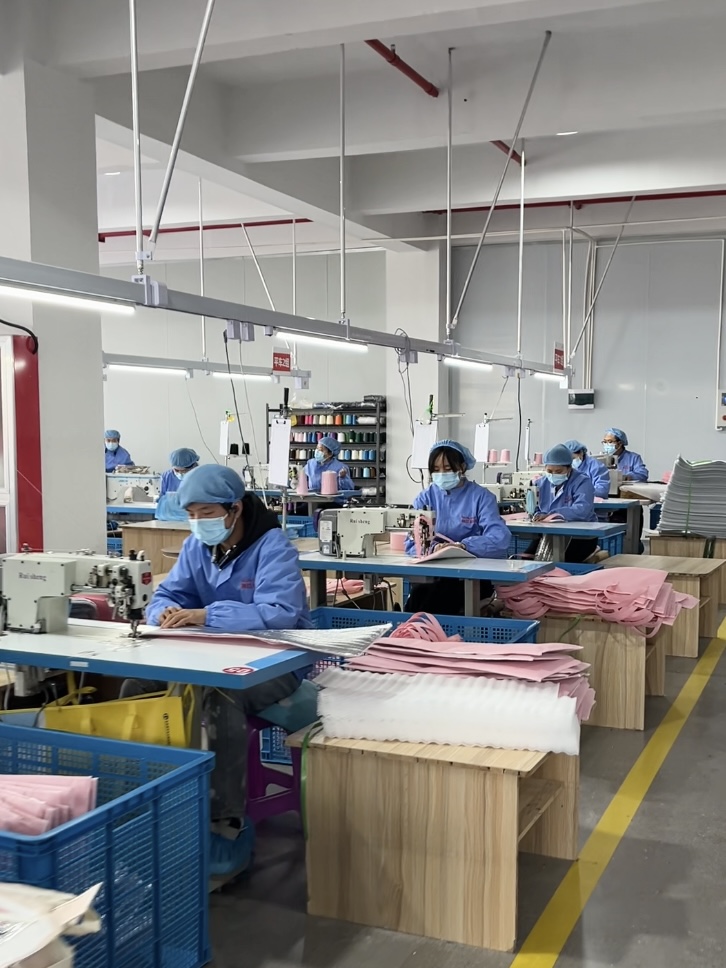Runjiang Sewing Workshop - sewing workstations for textile product manufacturing at Zhejiang Runjiang New Material Technology Co., Ltd.