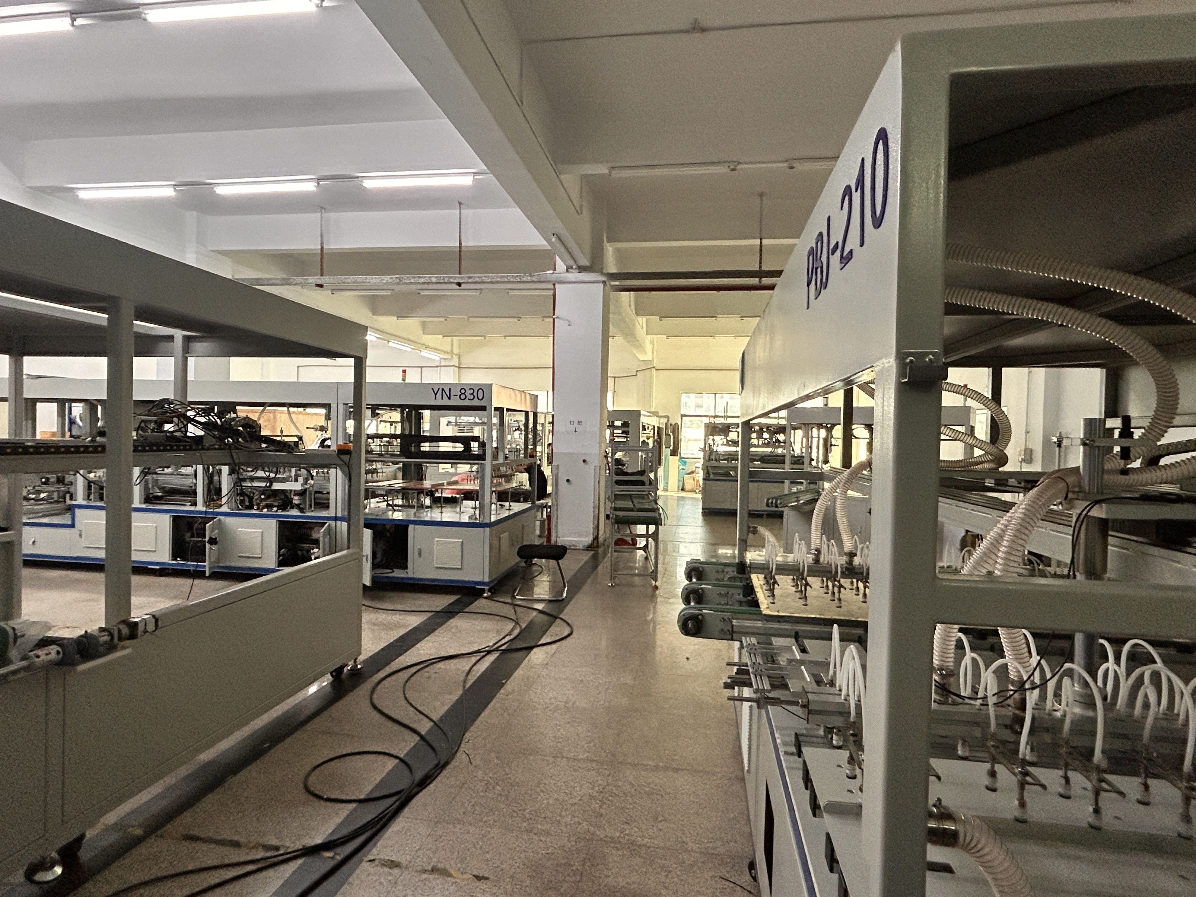 PV module manufacturing equipment on a solar panel production line, including the in-line EL inspection station