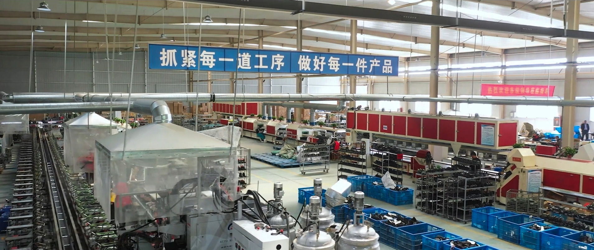 Safety footwear production workshop with assembly lines at the GUYISA manufacturing plant in Weifang, Shandong