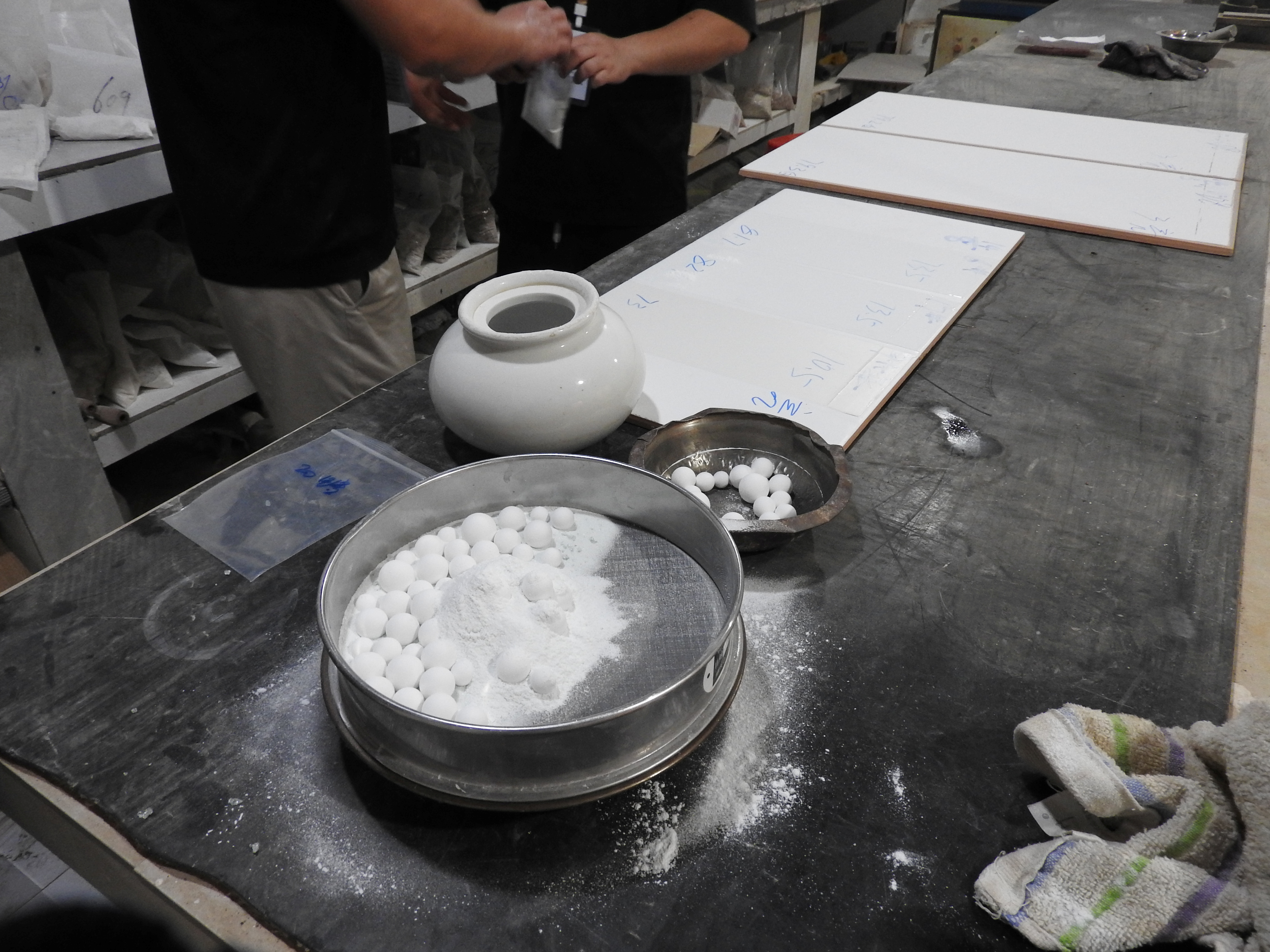 Technicians testing and retaining samples from each batch of ceramic frit
