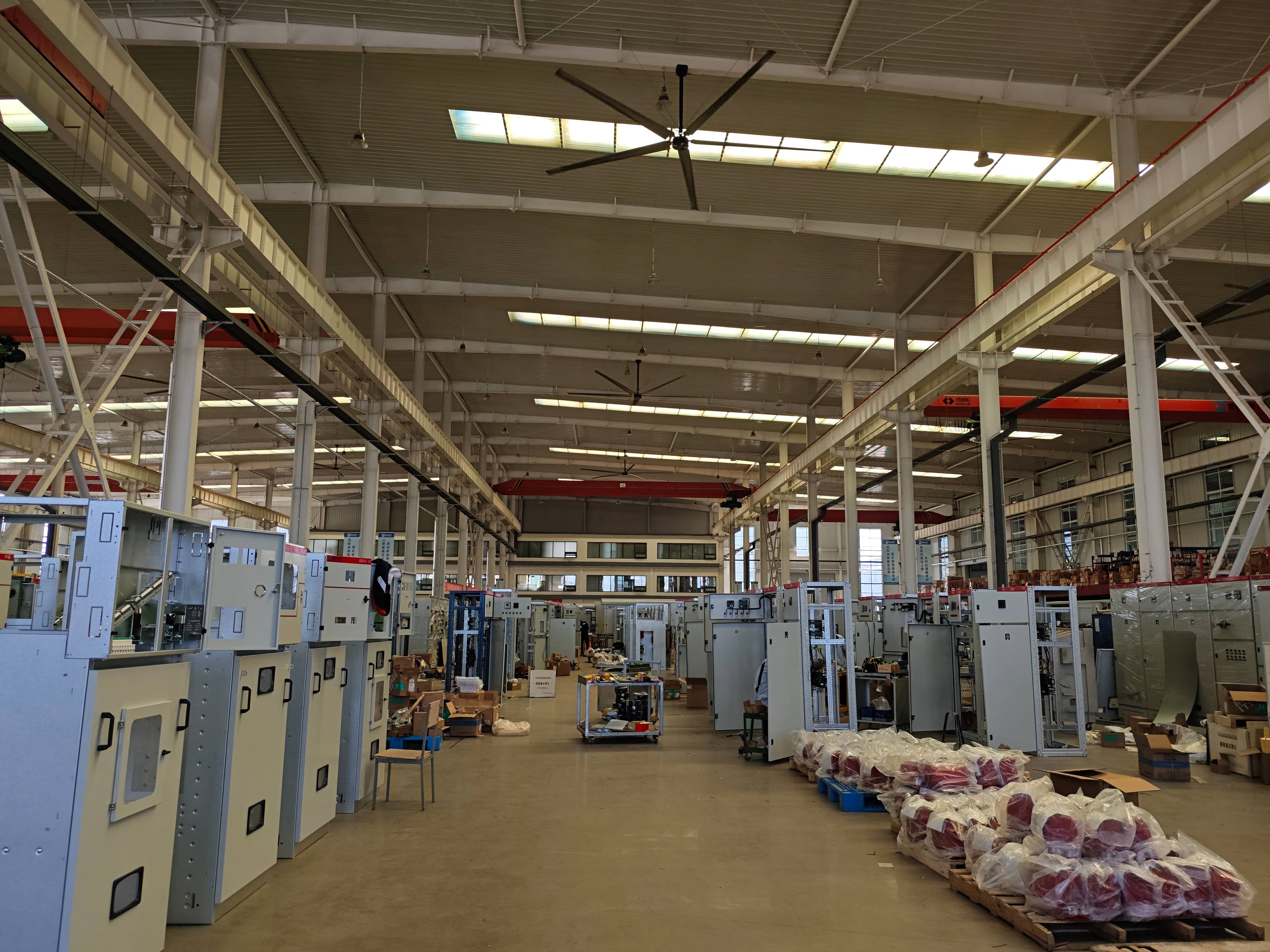 Prefabricated substation assembly workshop for the installation of circuit breakers, disconnect switches, current and voltage transformers, and other electrical components. Equipment is assembled and connected inside the substation enclosure according to the electrical design.