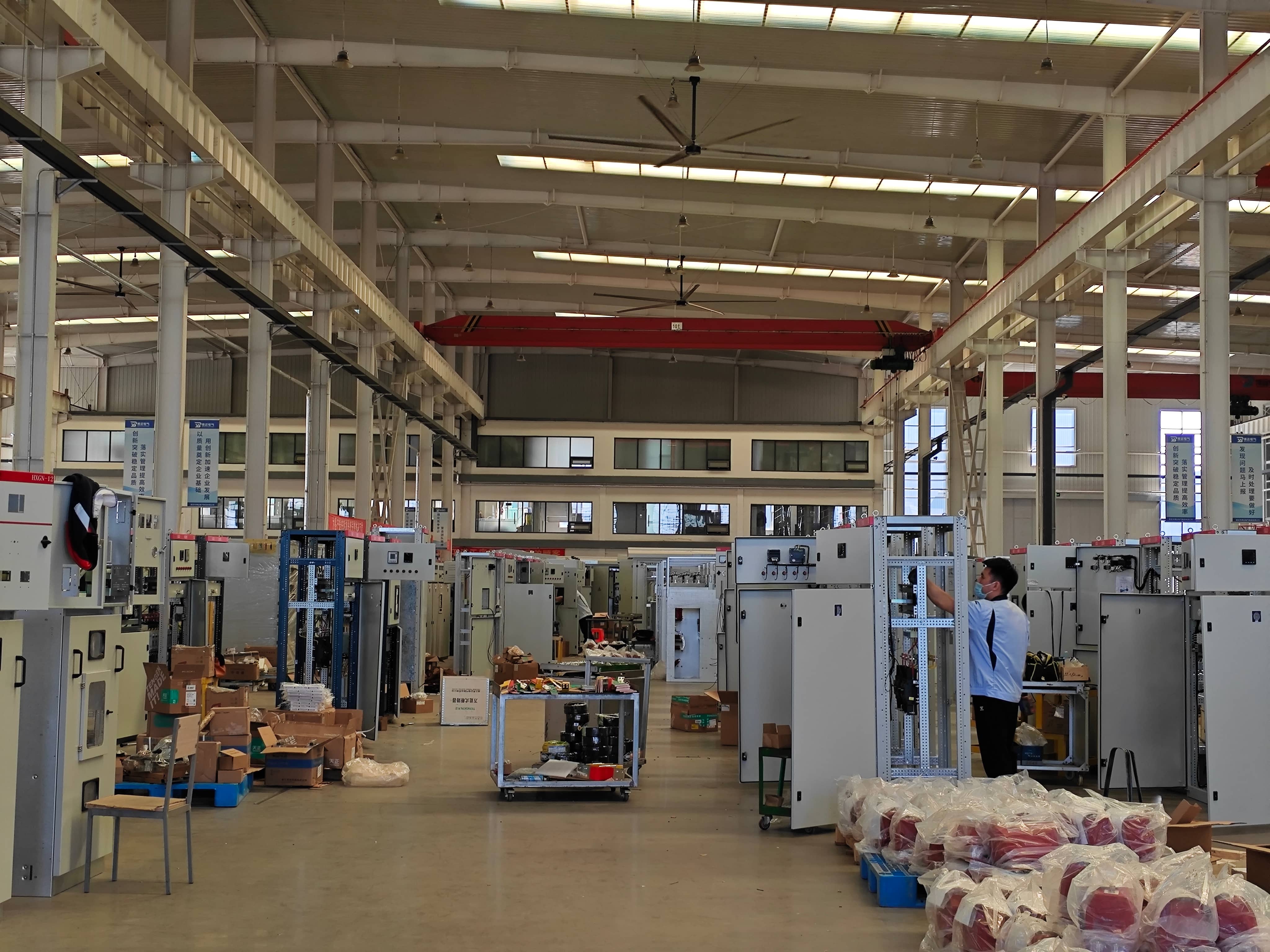 Detailed view of electrical component installation inside a prefabricated substation, including circuit breakers, disconnect switches, instrument transformers, and associated connections. The assembly process covers the installation and arrangement of equipment within the substation.