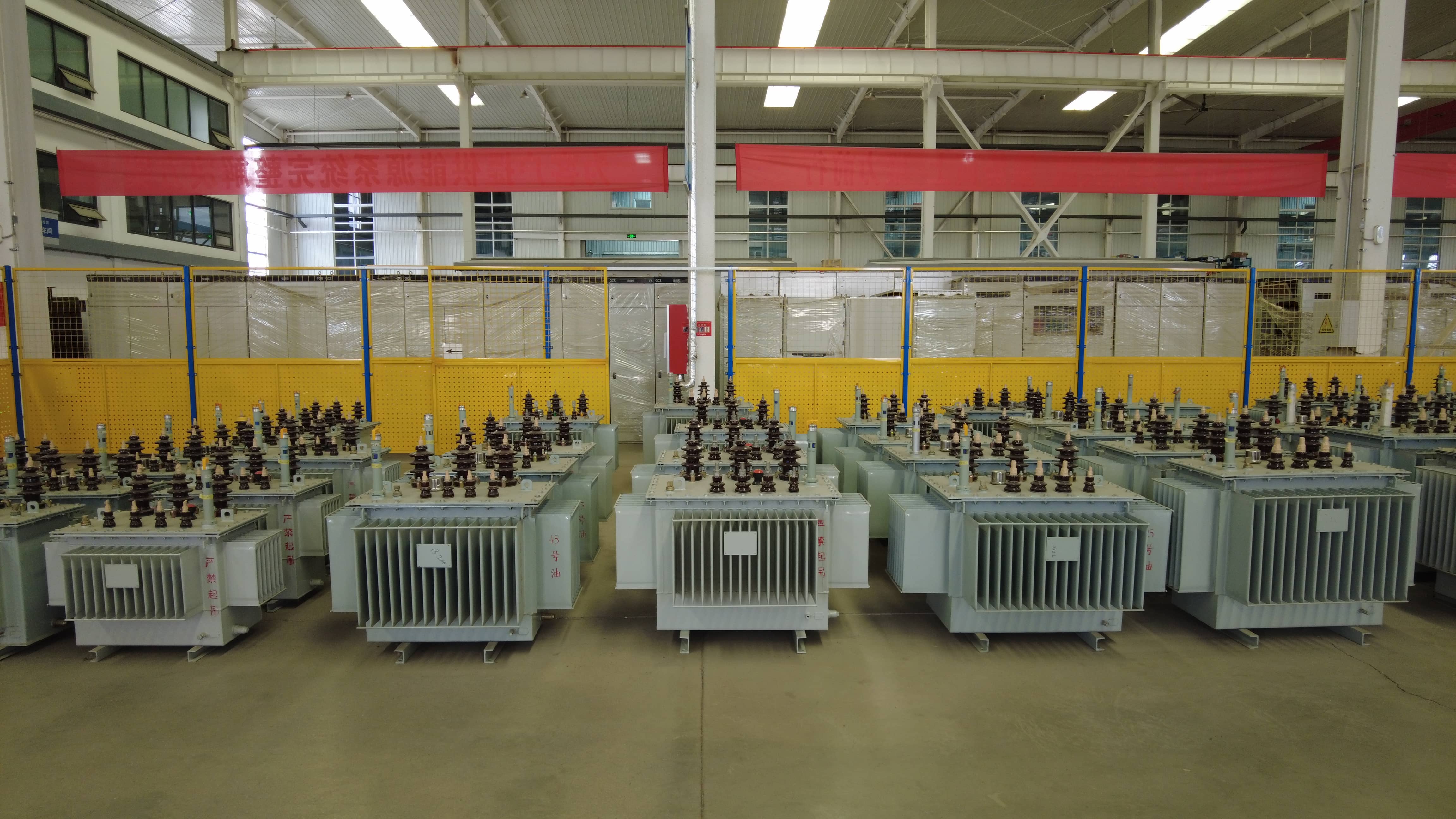 Finished oil-immersed distribution transformers stored at Milestone Electrical's manufacturing facility before packing and delivery. The factory handles transformer production, finished product storage, and shipment preparation for electrical distribution projects, industrial customers, and power equipment procurement orders.