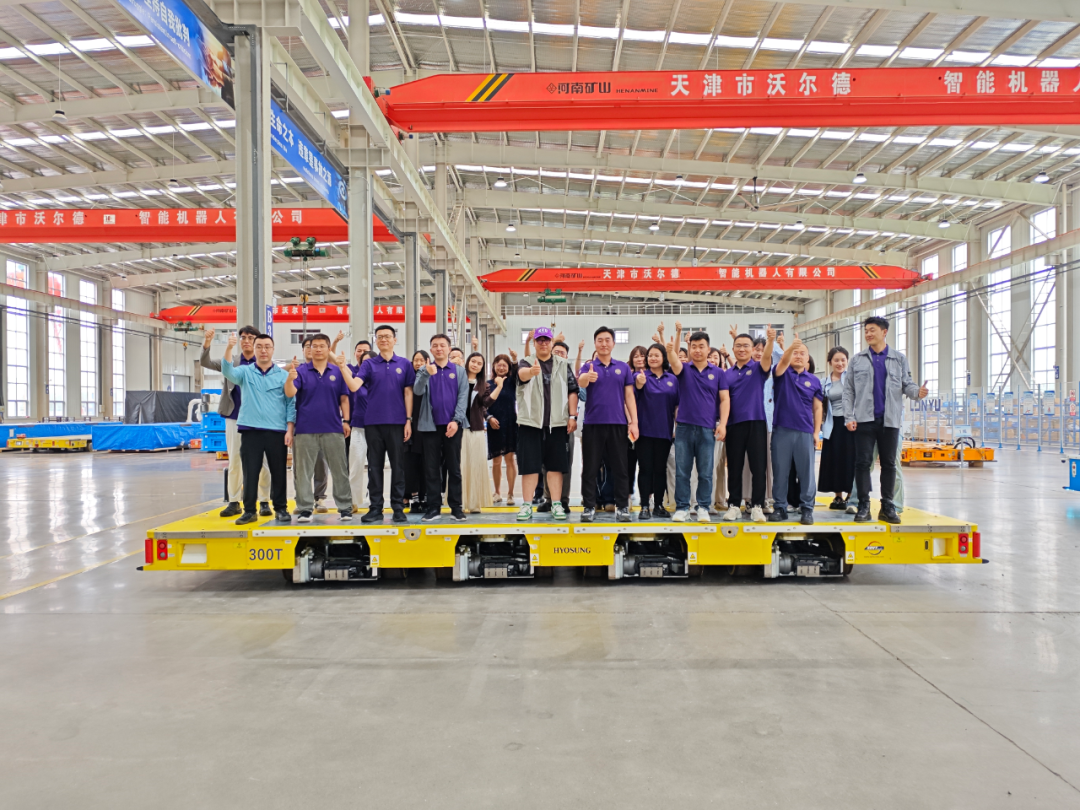 Heavy duty AGV production workshop with multi-wheel platforms under assembly
